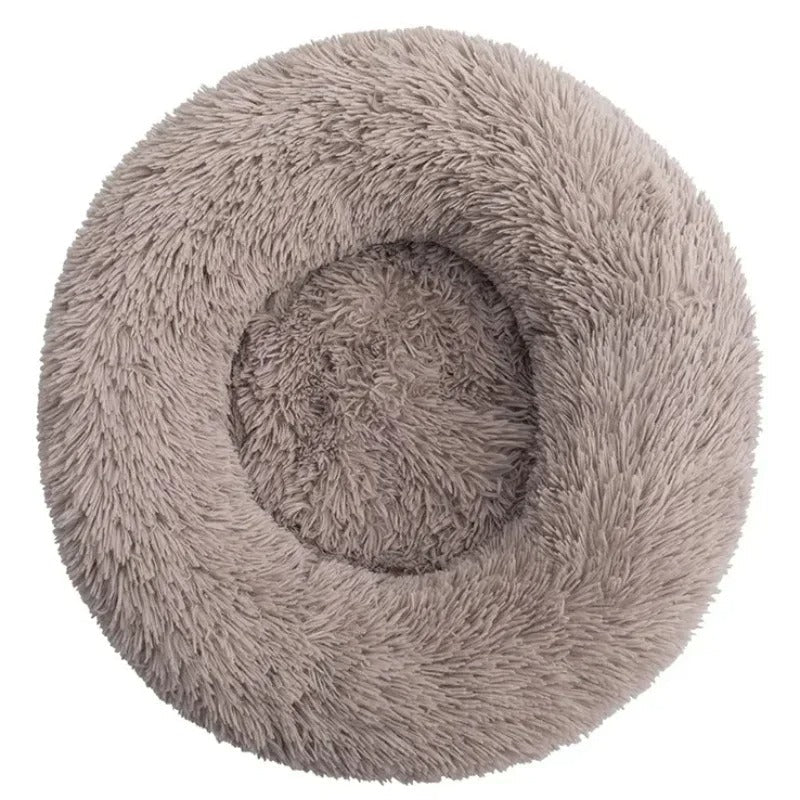 Round fluffy pet bed in light gray, plush donut design for cats and small dogs, cozy and soft for comfort, ideal for pet relaxation and sleep.