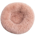 Fluffy pink round pet bed, plush donut design, cozy and soft for cats and small dogs, ideal for comfort and relaxation.