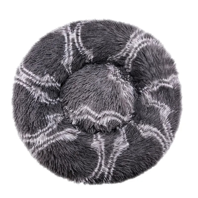 Round gray plush pet bed with soft faux fur, featuring a calming donut shape design. Ideal for cats and small dogs seeking comfort and warmth.