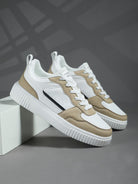 Stylish white and beige sneakers with black accents on a gray background, featuring a modern design and durable sole, perfect for casual wear.