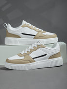 White and beige sneakers with black stripe, featuring a chunky sole design. Stylish casual footwear for men and women. Perfect for everyday wear.