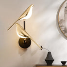 Gold-plated bird design LED wall lamp, modern lighting fixture for living room or bedroom decor, featuring elegant and artistic craftsmanship.