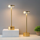 Modern gold LED table lamps with sleek cylindrical design, featuring adjustable brightness. Perfect for contemporary home decor and ambient lighting.