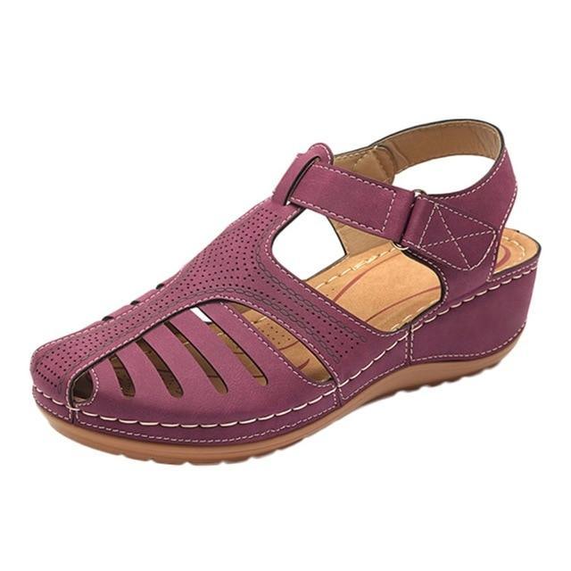 Purple orthopedic sandal with low heel, breathable design, and correction function. Ideal for comfort and support. Perfect for women's summer footwear.