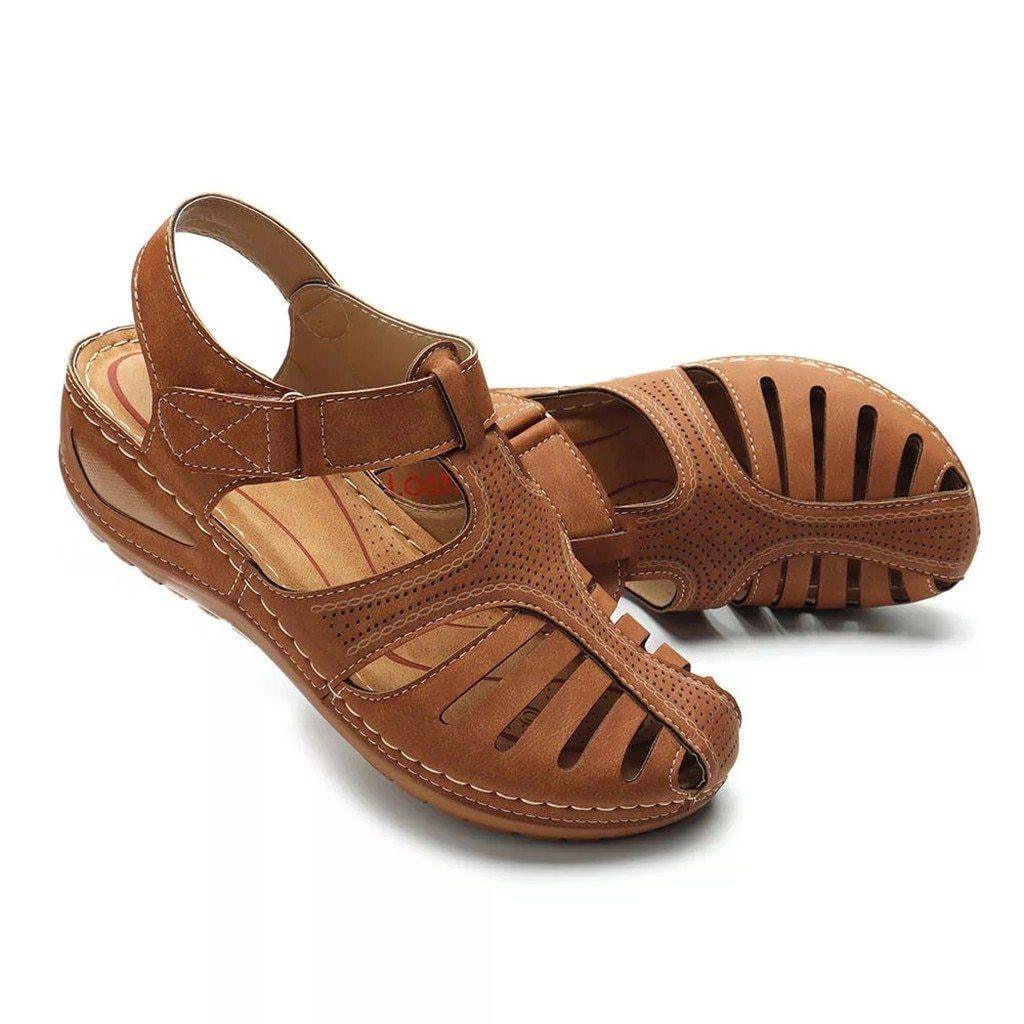 Brown orthopedic sandals with low heel, breathable design, and correction function. Ideal for comfort and support. Perfect for casual wear.