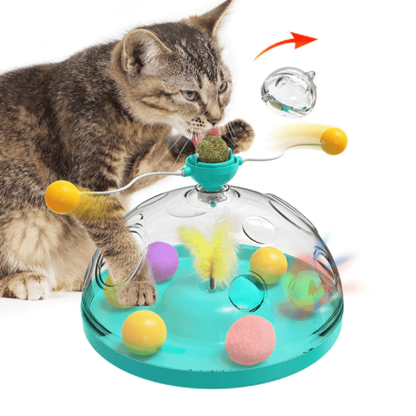 Cat playing with interactive windmill toy; features spinning balls, feather, and suction cup base. Ideal pet entertainment, boredom relief gadget.