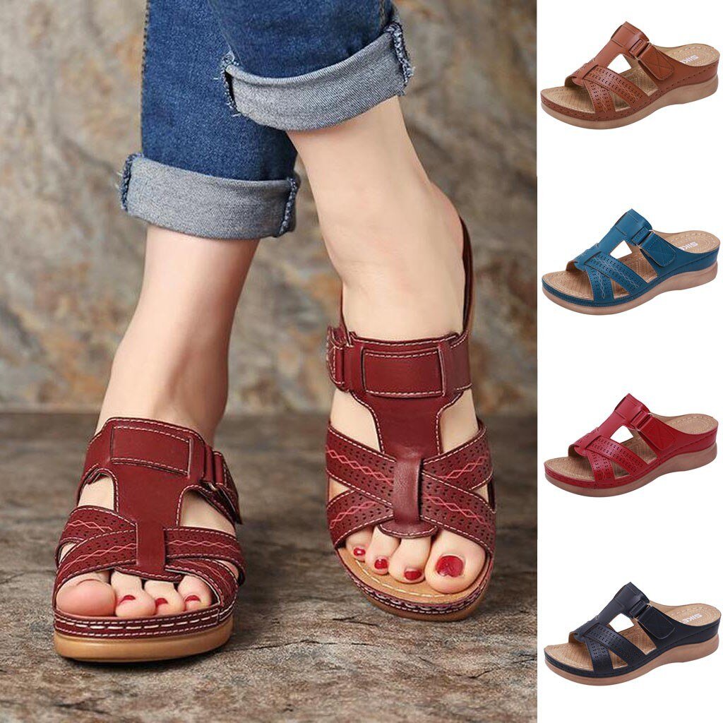 Women's orthopedic sandals in red leather with adjustable straps, cushioned sole, and ergonomic design. Available in multiple colors for comfort and style.