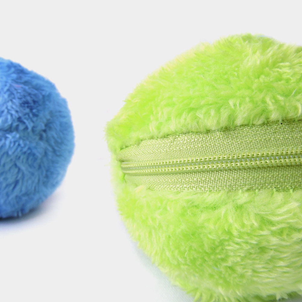 Fluffy green and blue plush balls with zippers, soft texture, perfect for kids' toys or pet play. High-quality, durable, and colorful design.