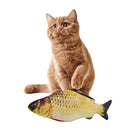 Orange tabby cat playing with realistic fish toy on white background. Cat toy, pet accessories, playful kitten, interactive pet products.