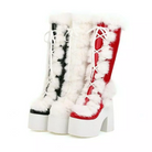 Red and black platform boots with white faux fur trim and pom-poms, featuring chunky heels and lace-up design, perfect for winter fashion.