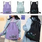 Drawstring backpacks in purple, mint, and black with floral embroidery, ideal for casual outings. Stylish, lightweight, and versatile bag options.