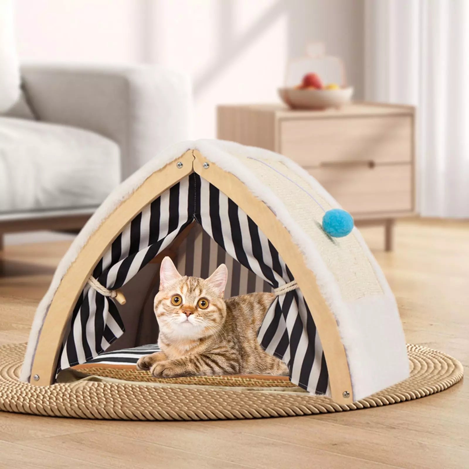 Cozy cat tent with striped interior, featuring a cute tabby cat lounging inside. Perfect pet bed for indoor cats. Stylish home decor accessory.