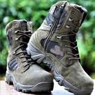 Tactical military boots with camouflage pattern, durable suede material, side zipper, and rugged sole, ideal for outdoor hiking and combat use.