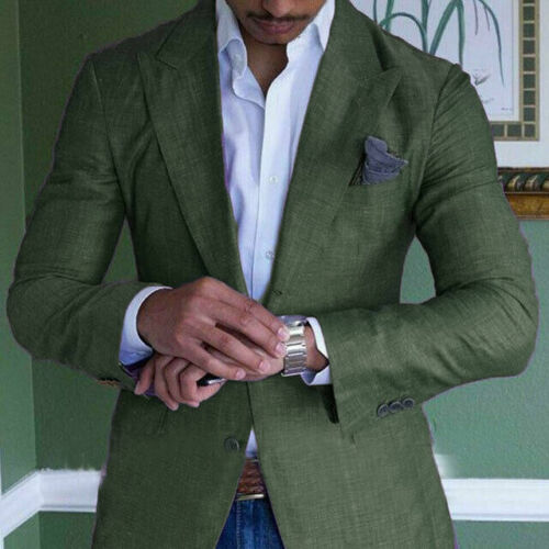Man in green linen blazer adjusting silver watch, white shirt, pocket square, stylish men's fashion.