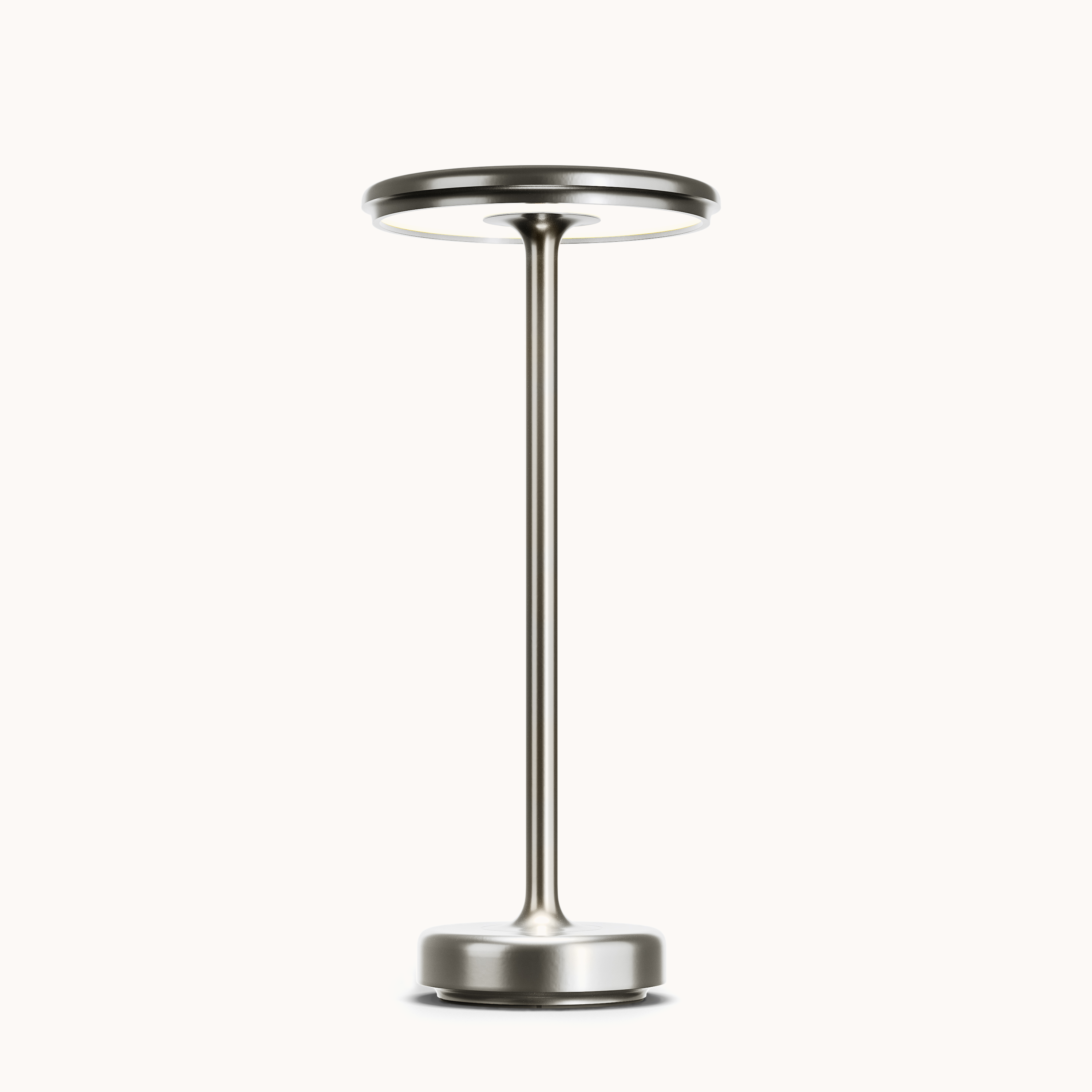 Sleek silver LED table lamp with modern minimalist design, featuring a circular light head and sturdy base. Ideal for contemporary home decor.