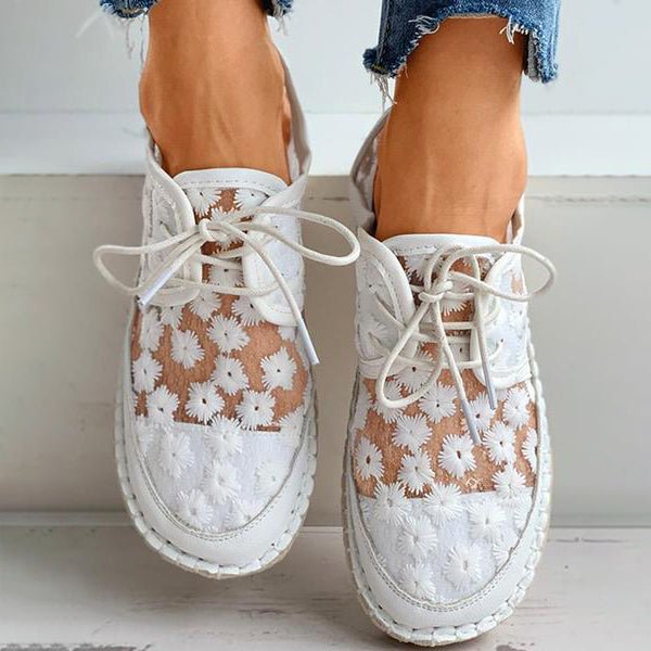 Stylish white floral mesh shoes with lace-up design, featuring breathable fabric and casual elegance, perfect for summer fashion trends.