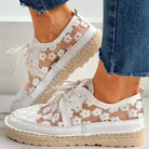 Stylish women's shoes with floral pattern, featuring breathable mesh and white lace design, perfect for casual wear. Fashionable footwear for summer.