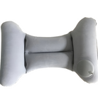 Gray inflatable travel pillow with ergonomic design, featuring a circular air valve for easy inflation. Ideal for neck support and comfort during travel.