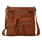 Brown leather crossbody bag with multiple zippered pockets and adjustable strap, ideal for travel and everyday use. Stylish and functional handbag.