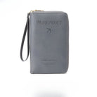 Gray leather travel wallet with "Passport" embossed, featuring a wrist strap and airplane icon. Ideal for secure travel document organization.