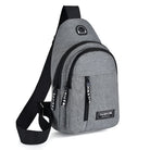 Stylish gray sling backpack with multiple zippered compartments, adjustable strap, and "Fashion" label. Ideal for travel, school, or casual use.