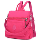 Vibrant pink backpack purse with multiple zippered compartments, adjustable straps, and a stylish design. Perfect for travel and daily use.