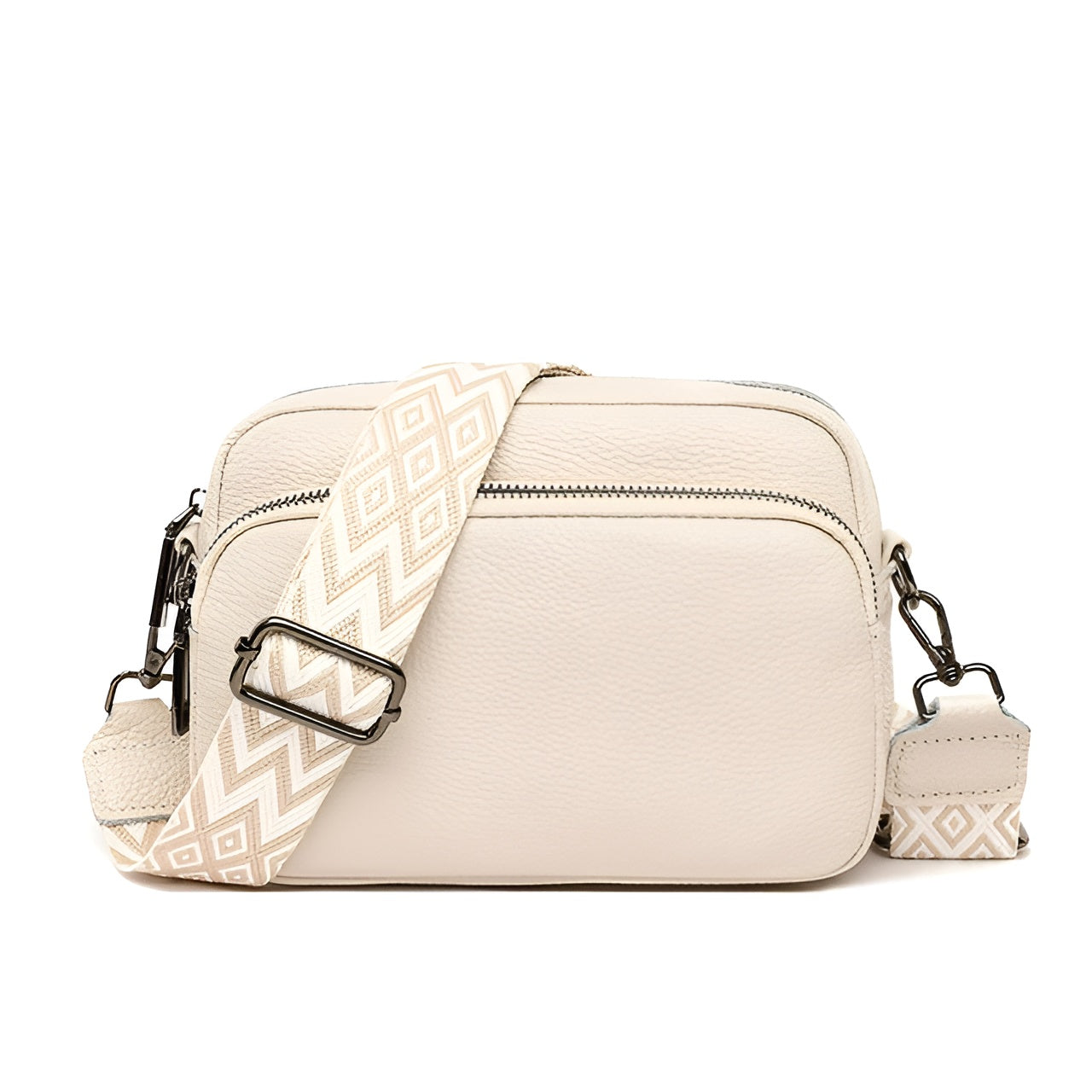 Cream leather crossbody bag with geometric strap, front zip pocket, and adjustable buckle. Stylish women's accessory for casual and formal wear.