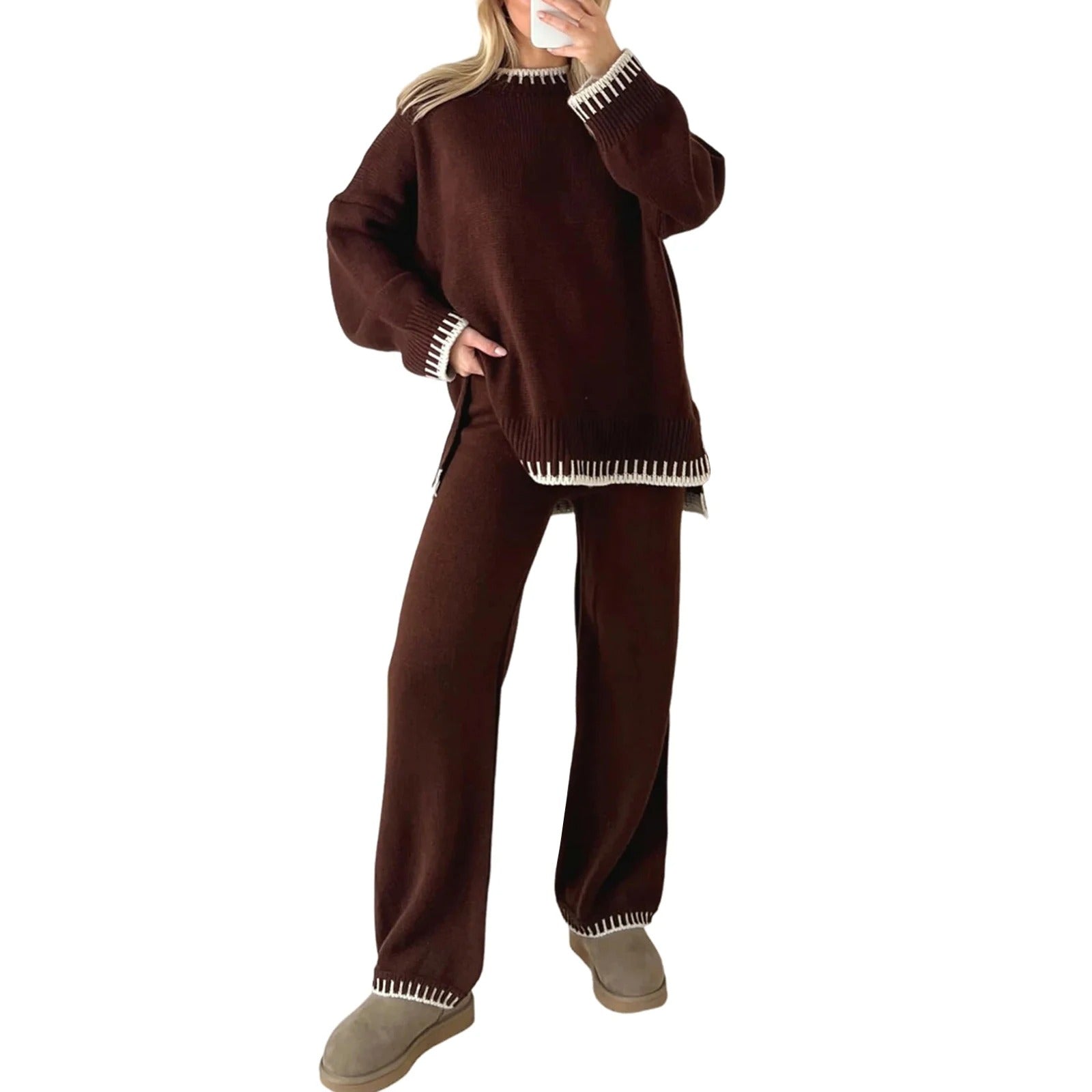 Woman wearing a brown knit sweater and pants set with white trim, paired with beige slippers. Cozy loungewear fashion, comfortable winter outfit.