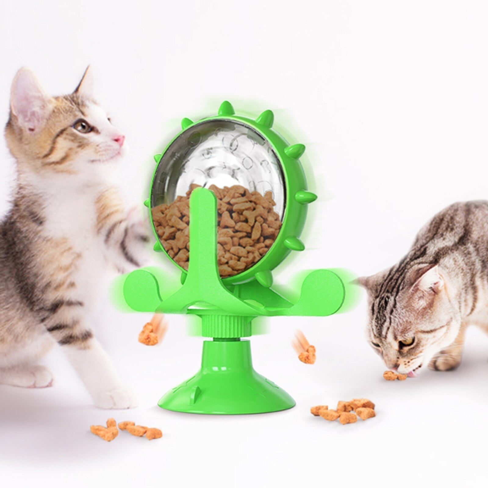 Interactive green pet feeder toy for small dogs and cats, rotating treat dispenser, slow feeding, engaging playtime, durable design, pet enrichment.