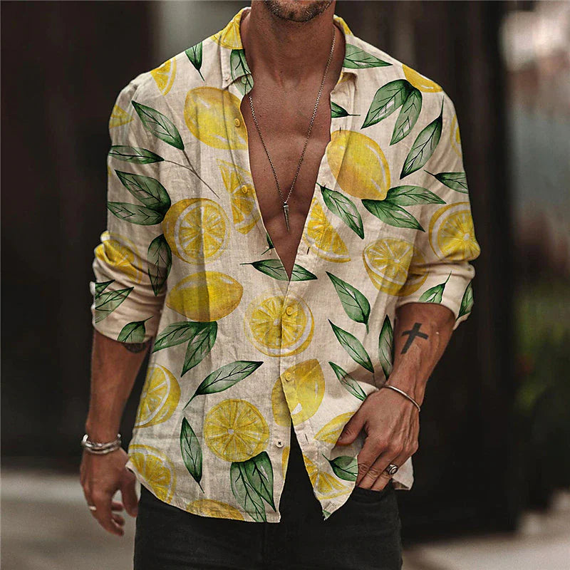 Man wearing a stylish lemon print shirt with rolled-up sleeves, open front, and casual accessories. Trendy summer fashion, men's casual wear.